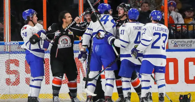 Wichita Thunder exchanges pleasantries with the Kansas City Mavericks