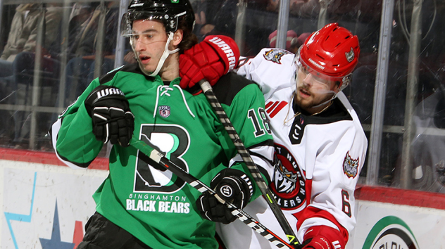Binghamton Black Bears forward Bret Parker (left) vs. the Port Huron Prowlers