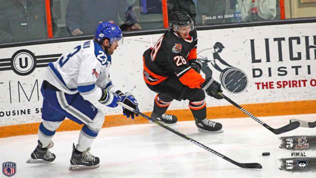 Danbury Hat Tricks forward Dmitry Kuznetsov (right) vs. the Watertown Wolves