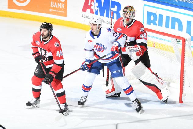 Belleville Senators defenseman Jonathan Aspirot and goaltender Mads Sogaard defend against the Rochester Americans