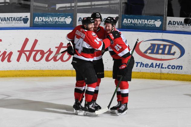 Belleville Senators celebrate a goal against the Rochester Americans