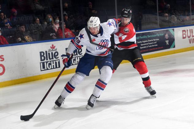 Belleville Senators defenseman Michael Del Zotto (right) vs. the Rochester Americans