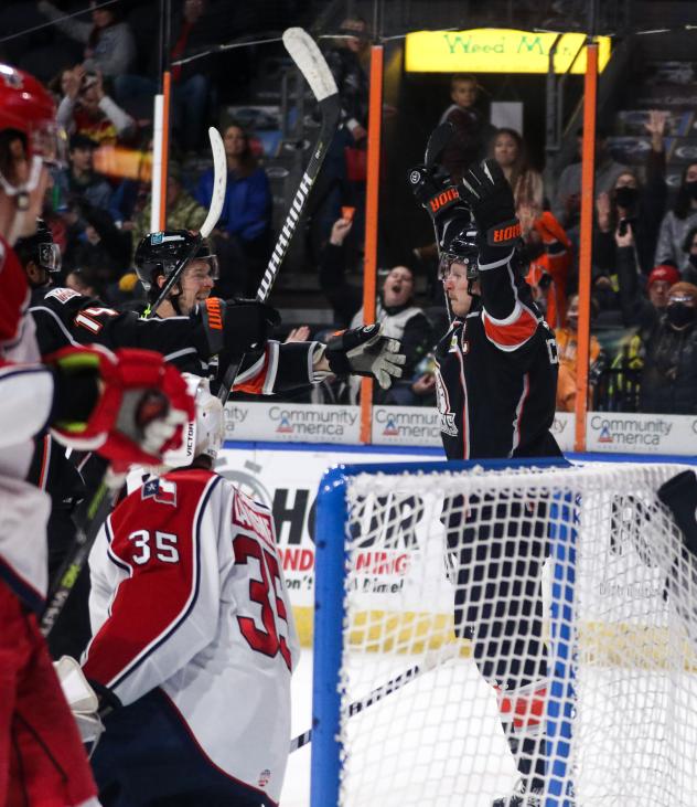 Allen Americans watch as Kansas City Mavericks celebrate a goal