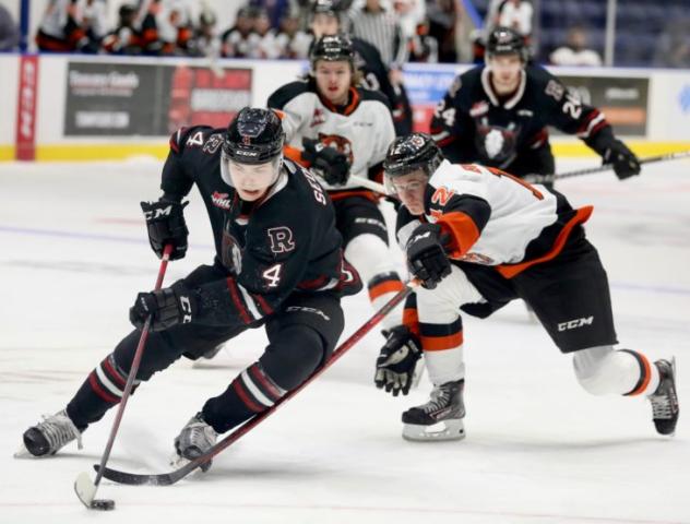 Red Deer Rebels defenceman Christoffer Sedoff (left) vs. the Medicine Hat Tigers