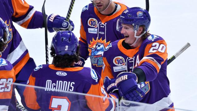 Orlando Solar Bears defenseman Michael Brodzinski (right) helps celebrate a goal