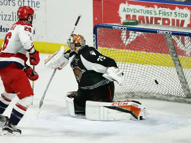 Allen Americans forward Spencer Asuchak scores against the Utah Grizzlies