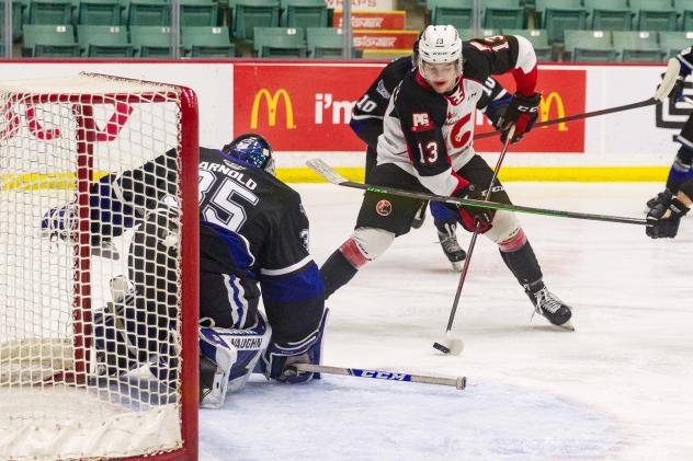 Prince George Cougars centre Koehn Ziemmer (right) vs. the Victoria Royals