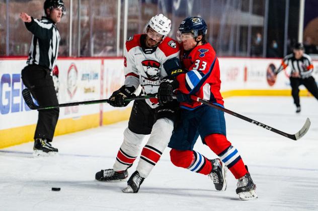 Springfield Thunderbirds defenseman Michael Kim (right) vs. the Charlotte Checkers