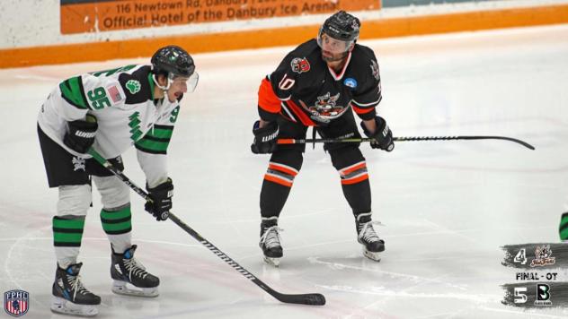 Danbury Hat Tricks forward Tom Mele (right) vs. the Binghamton Black Bears