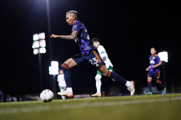 Seattle Sounders FC midfielder Leo Chu vs. the Portland Timbers in preseason action in Tucson, AZ