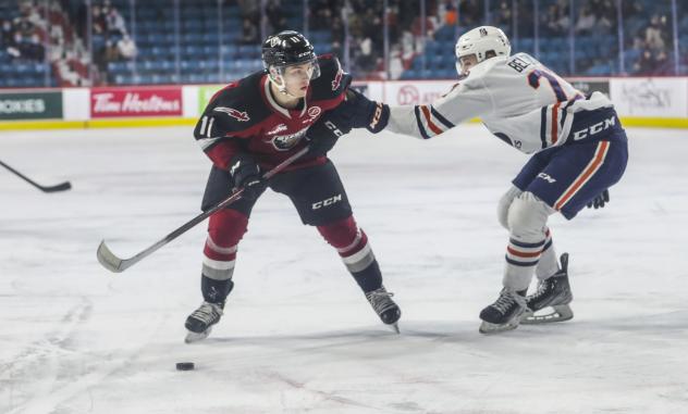Vancouver Giants right wing Fabian Lysell (left) vs. the Kamloops Blazers
