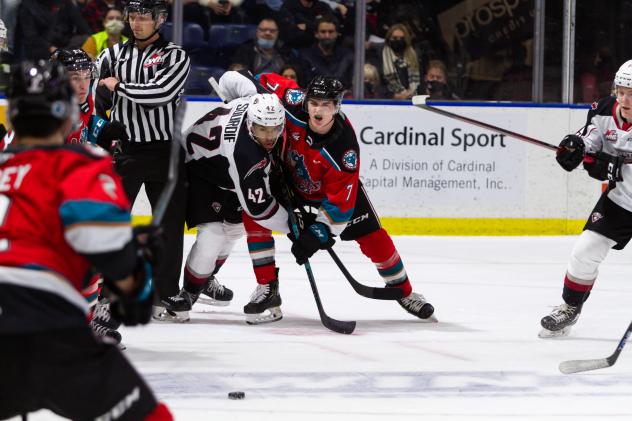 Kelowna Rockets centre Max Graham (right) battles the Vancouver Giants