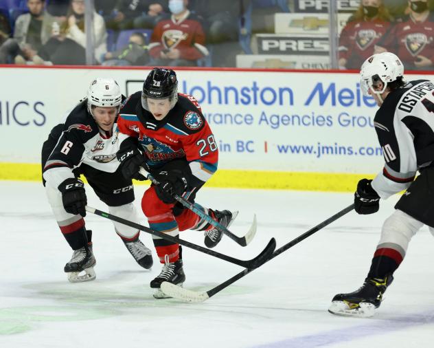 Vancouver Giants defenseman Evan Toth (left) vs. the Kelowna Rockets