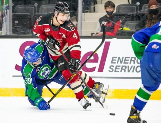Red Deer Rebels defenceman Christoffer Sedoff (right) vs. the Swift Current Broncos