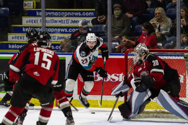 Kelowna Rockets right wing Jake Poole (center) vs. the Vancouver Giants