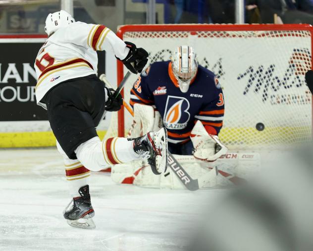 Vancouver Giants defenceman Evan Toth takes a shot against the Kamloops Blazers