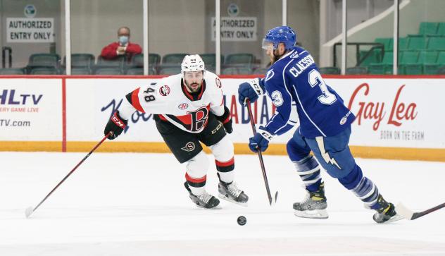 Belleville Senators defenceman Jonathan Aspirot (left) vs. the Syracuse Crunch