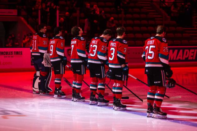 Kelowna Rockets line up before a game