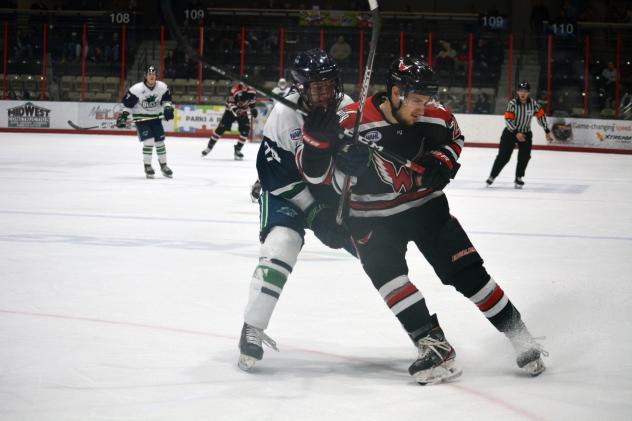 North Iowa Bulls forward Jack Campion (left) gets tangled up with an Aberdeen Wing