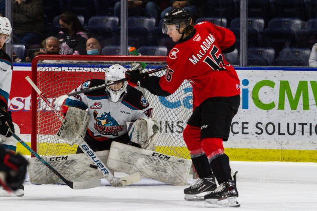Prince George Cougars left wing Carter MacAdams vs. the Kelowna Rockets