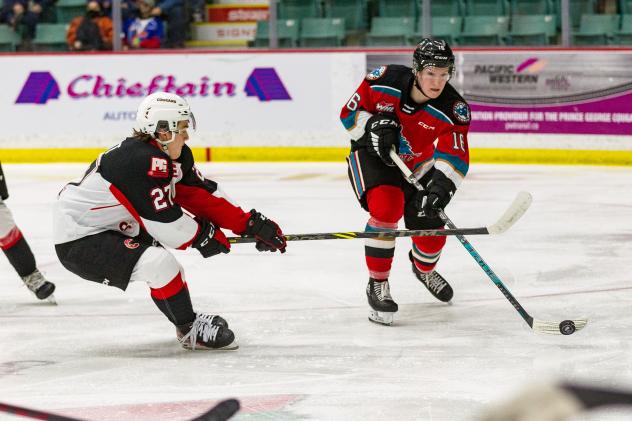 Kelowna Rockets left wing Scott Cousins (right) vs. the Prince Goerge Cougars