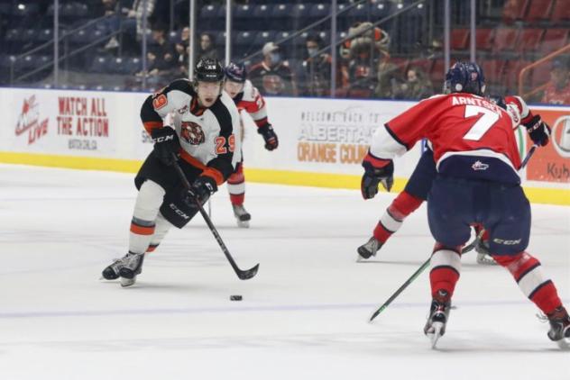 Medicine Hat Tigers centre Owen MacNeil vs. the Lethbridge Hurricanes