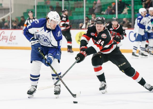 Belleville Senators left wing Roby Jarventie (right) vs. the Syracuse Crunch