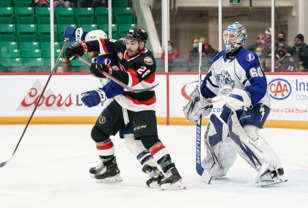 Belleville Senators left wing Tyrell Goulbourne (left) vs. the Syracuse Crunch