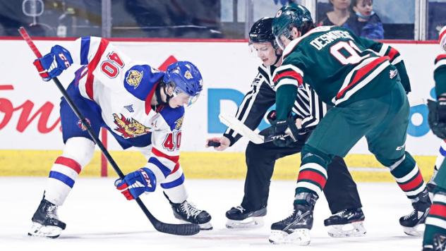 Moncton Wildcats centre Jonas Taibel (left) vs. the Halifax Mooseheads