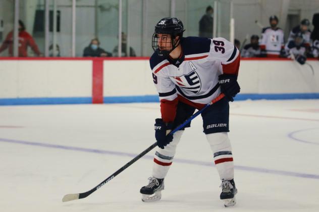 Defenseman C.J. Valerian with New England College