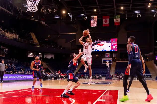 Justin James of the Cleveland Charge pulls up against the Capital City Go-Go