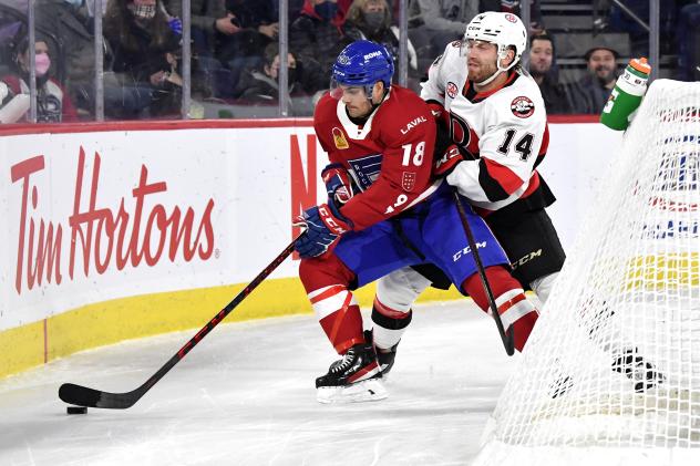 Belleville Senators centre Rourke Chartier (right) vs. the Laval Rocket