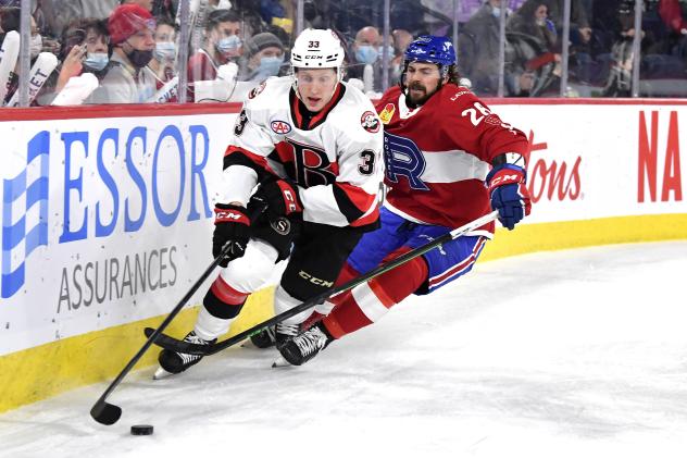 Belleville Senators defenceman Dillon Heatherington (left) vs. the Laval Rocket