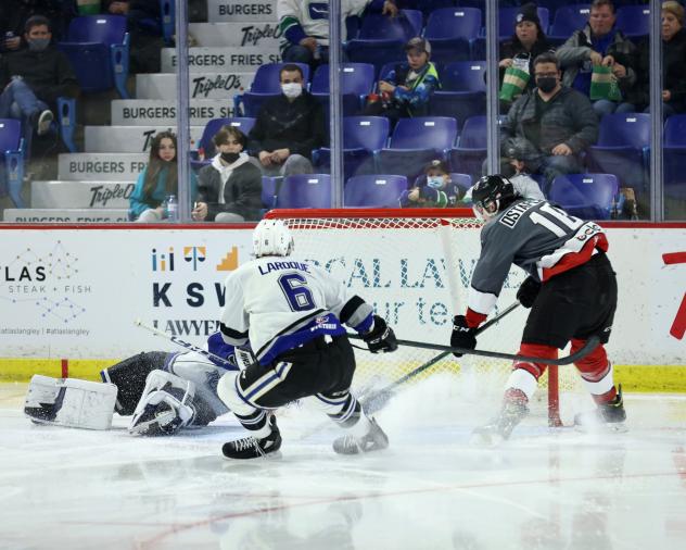 Vancouver Giants left wing Zach Ostapchuk (right) vs. the Victoria Royals