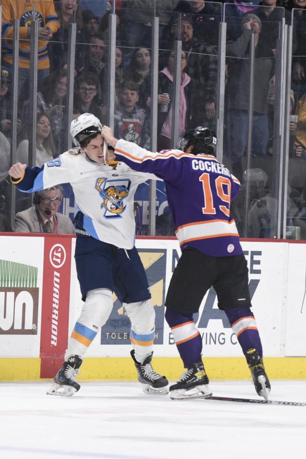 Reading Royals defenseman Garret Cockerill lands a blow against the Toledo Walleye