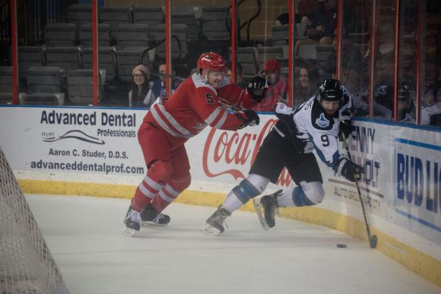 Rapid City Rush defenseman Quinn Wichers (left)