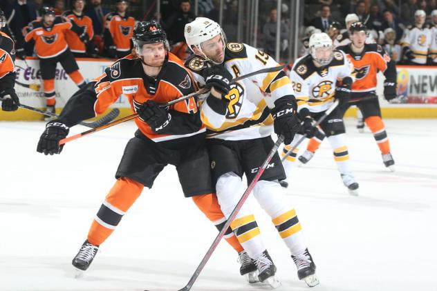 Lehigh Valley Phantoms defenseman Cam York (left) vs. the Providence Bruins