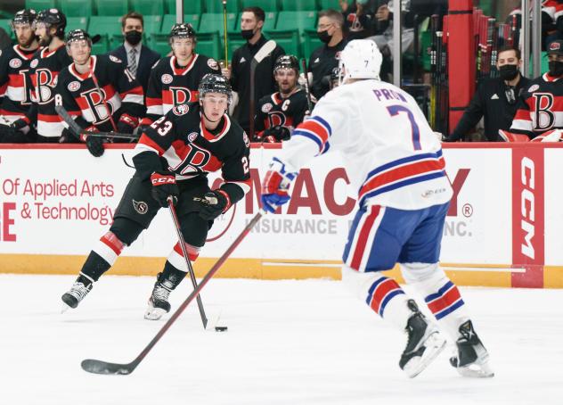 Belleville Senators left wing Cole Reinhardt (left) vs. the Rochester Americans