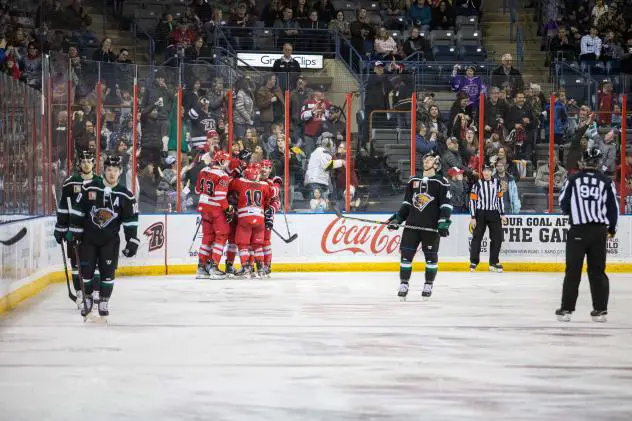 Rapid City Rush gather after a goal against the Utah Grizzlies