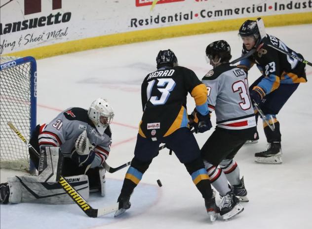 Wheeling Nailers goaltender Brody Claeys holds off the Toledo Walleye