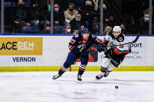 Kelowna Rockets left wing Adam Kydd (right) takes on the Kamloops Blazers