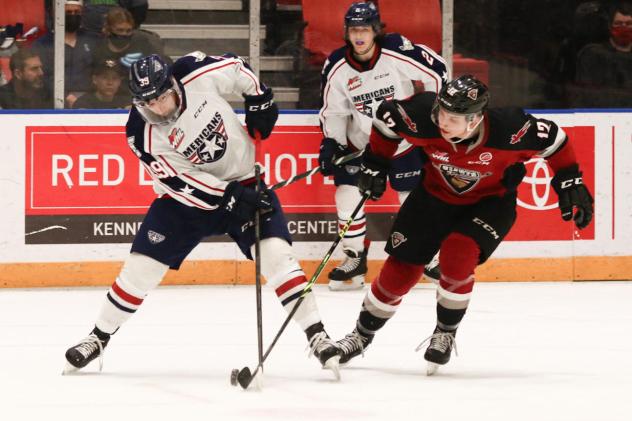 Vancouver Giants left wing Adam Hall (right) vs. the Tri-City Americans