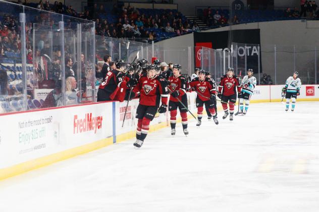 Vancouver Giants collect congratulations along the bench