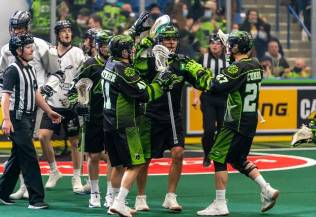 Saskatchewan Rush celebrate a goal against the Calgary Roughnecks
