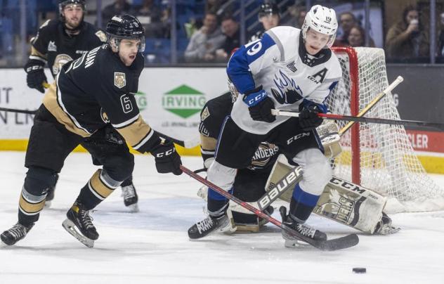 Saint John Sea Dogs centre Philippe Daoust (right) vs. the Charlottetown Islanders