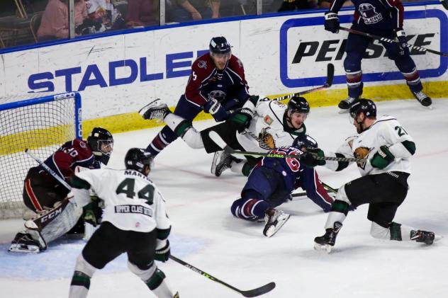 Utah Grizzlies forward Tyler Penner (far right) launches a shot against the Tulsa Oilers