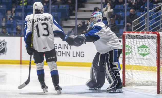 William Villeneuve and goaltender Thomas Couture of the Saint John Sea Dogs