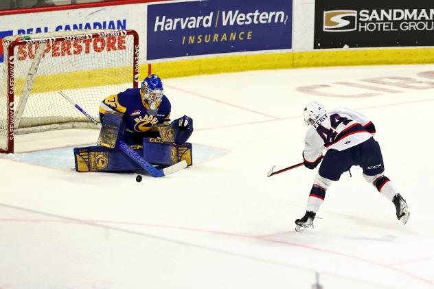Regina Pats defenceman Layton Feist shoots vs. the Saskatoon Blades