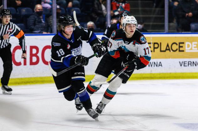 Kelowna Rockets centre Colton Dach (right) vs. the Victoria Royals