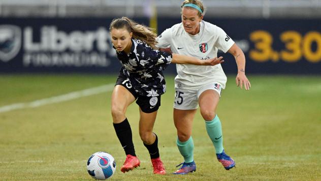 Racing Louisville FC forward Emina Ekic (left) vs. the Kansas City Current